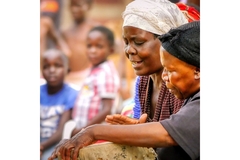 Image Women in Zimbabwe playing drums and cooking